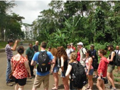 Figure 1. Students listen to biologists Jose Rojas and Oliver Castro from Costa Rica Tech during their lecture on the importance of tropical forest.